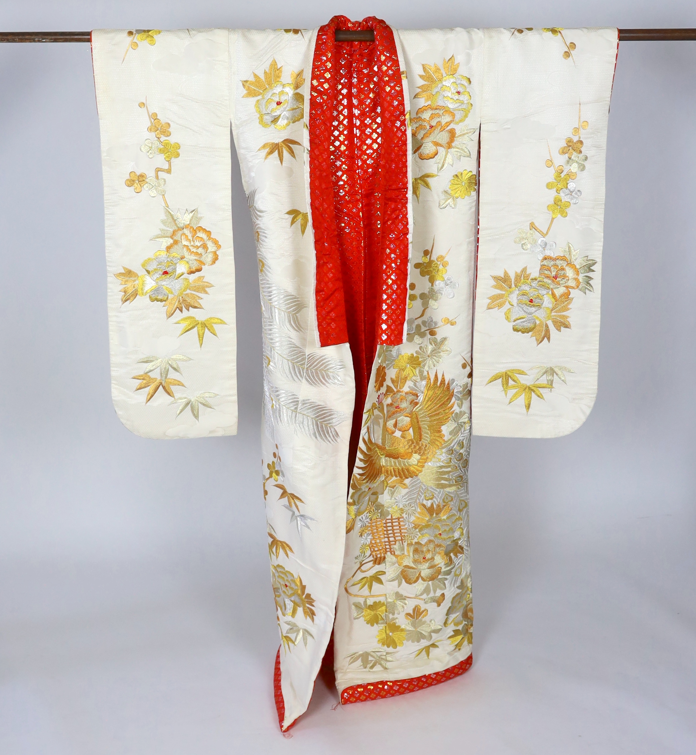 A 1960s-70s vintage Japanese embroidered wedding kimono, embroidered with pewter, bronze, silver and gold coloured metallic threads, into a large decorative design of peacocks with fanned tail feathers and trailing flowe